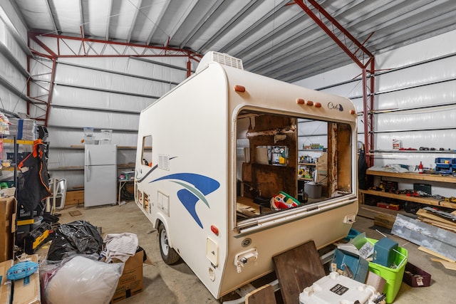 garage with white fridge