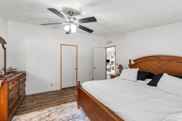 bedroom with ceiling fan and dark hardwood / wood-style flooring