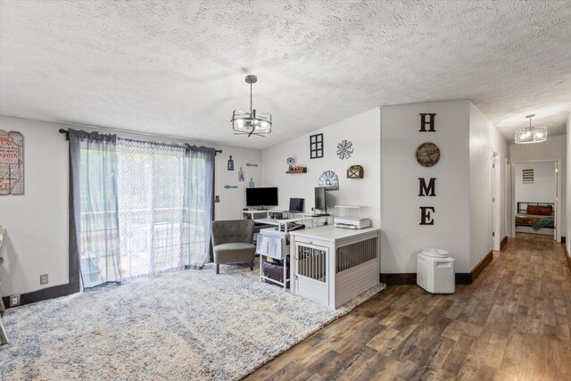 office area featuring lofted ceiling, a textured ceiling, dark hardwood / wood-style flooring, and an inviting chandelier