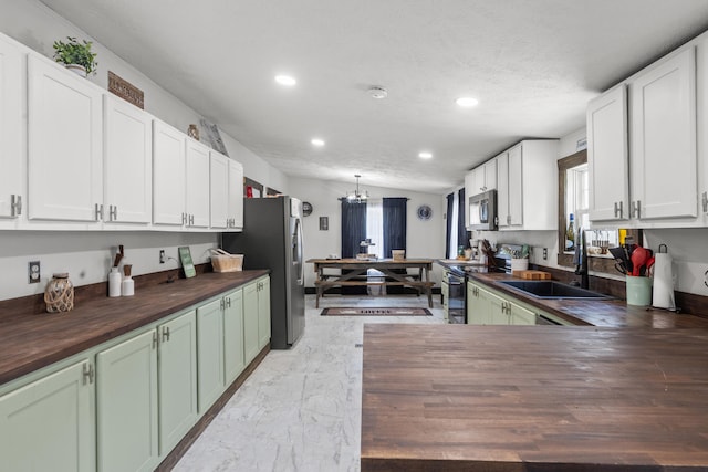 4743 Shoemaker Rdg, Zoe, KY 41397 - kitchen with white cabinets, marble finish floor, stainless steel appliances, butcher block counters, and a sink