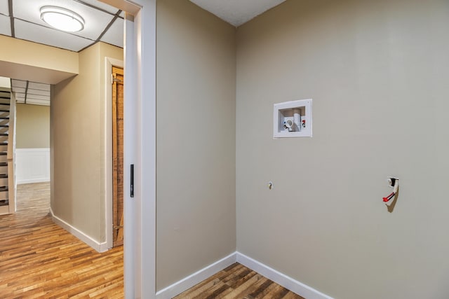 washroom with hookup for a washing machine and wood-type flooring