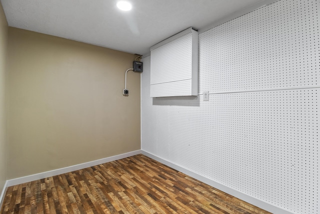 spare room with dark hardwood / wood-style floors