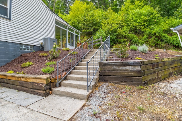 view of yard featuring cooling unit and a sunroom