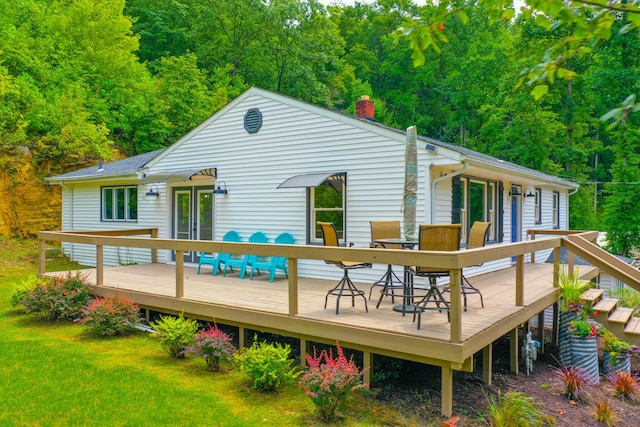 back of house with a yard and a wooden deck