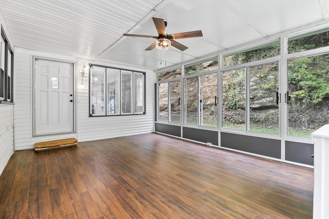 unfurnished sunroom featuring ceiling fan