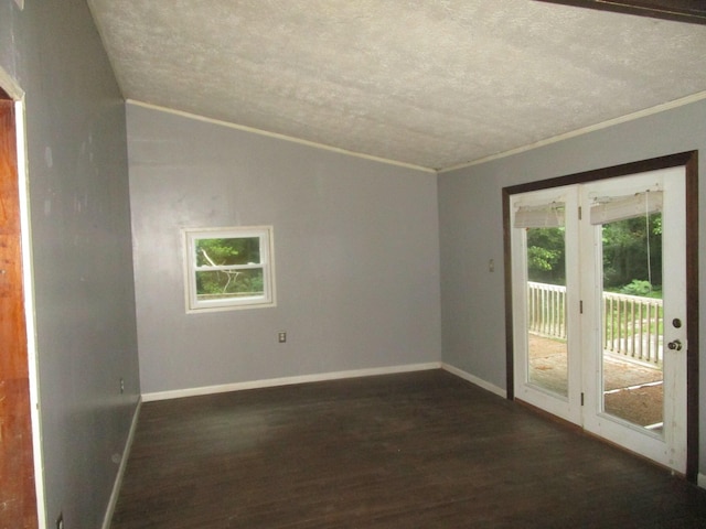 empty room with ornamental molding, lofted ceiling, and dark hardwood / wood-style flooring