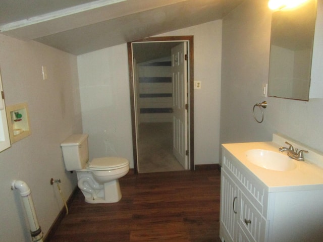 bathroom featuring vanity, hardwood / wood-style floors, and toilet