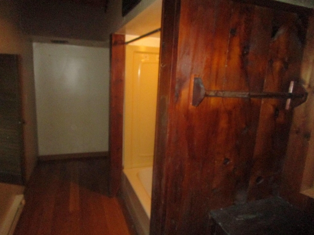 hall featuring dark wood-type flooring