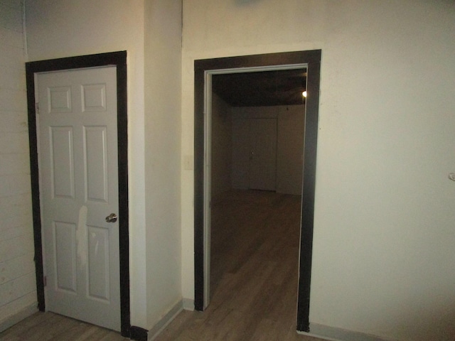 corridor with dark hardwood / wood-style floors