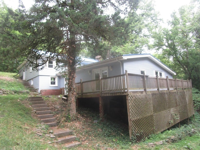 back of house featuring a wooden deck