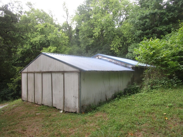 view of outdoor structure with a lawn