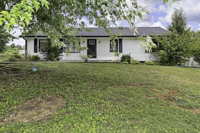 ranch-style home with a front lawn