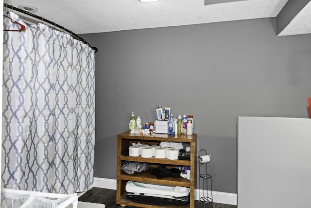 bathroom featuring wood-type flooring