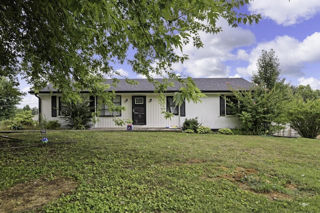 ranch-style house with a front lawn