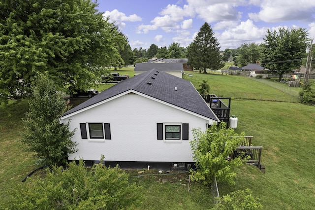 view of side of property featuring a yard