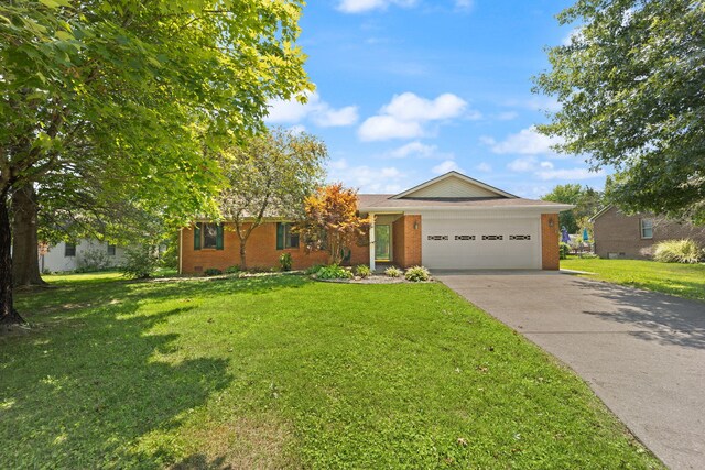 ranch-style house featuring a garage and a front yard