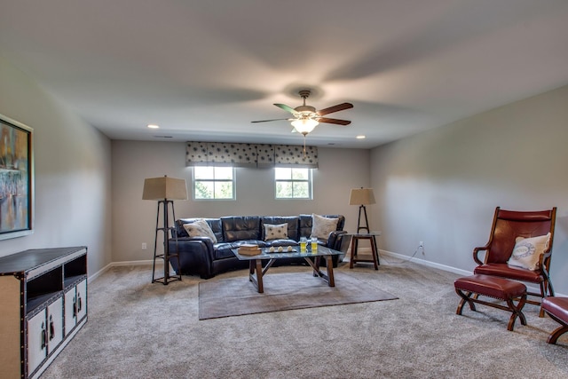 living room featuring light carpet and ceiling fan