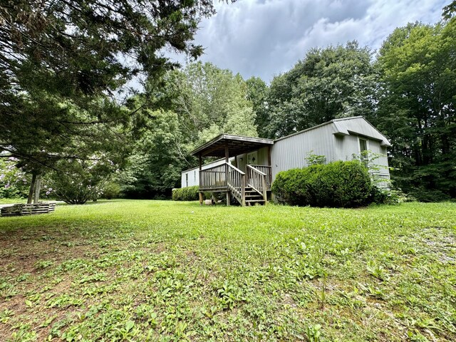 view of yard featuring a wooden deck