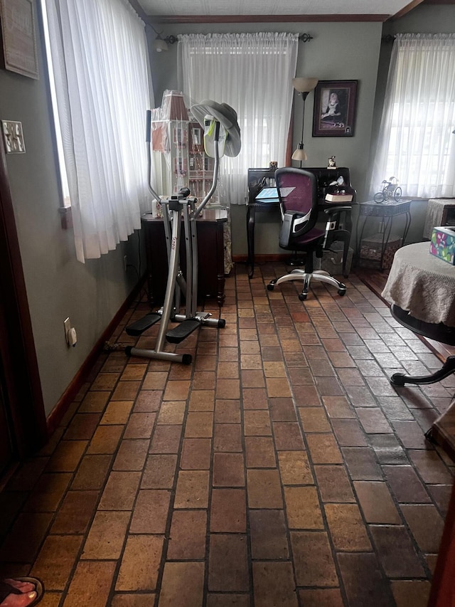 interior space with a wealth of natural light and brick floor