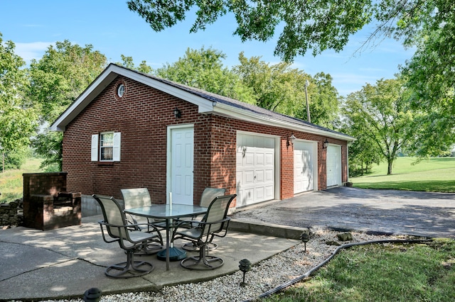 exterior space with a garage and an outdoor structure