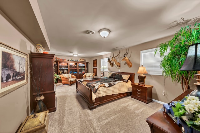 bedroom with light carpet