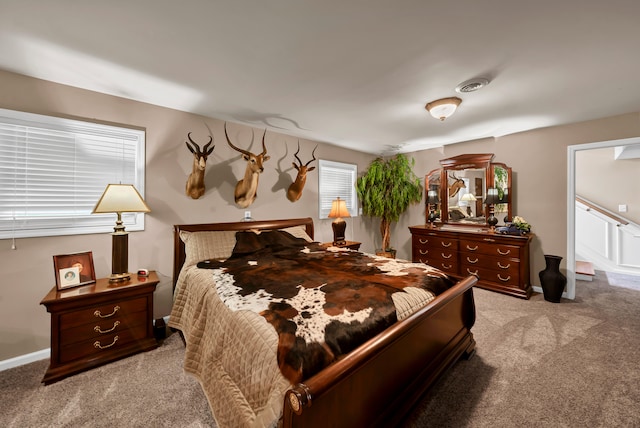 bedroom with light colored carpet