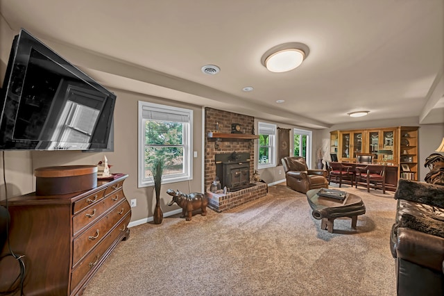 living room with brick wall, a fireplace, and light carpet