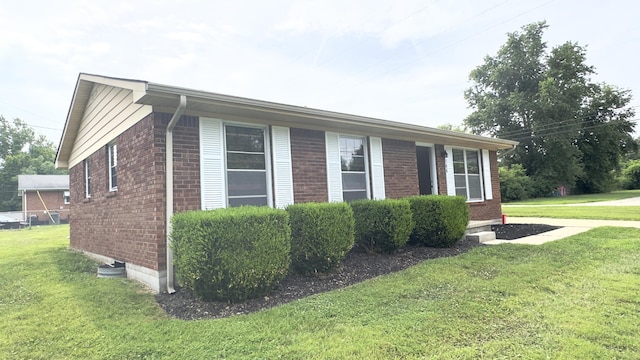 view of home's exterior featuring a yard