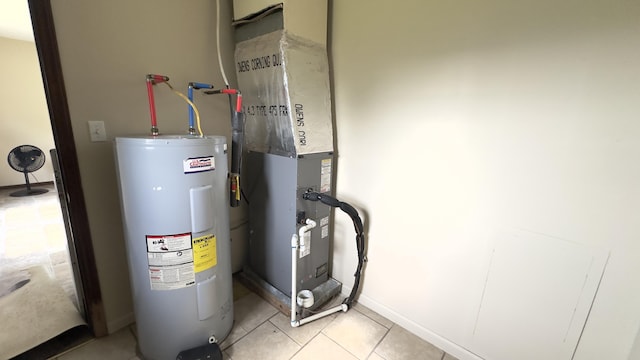 utility room featuring electric water heater and heating unit