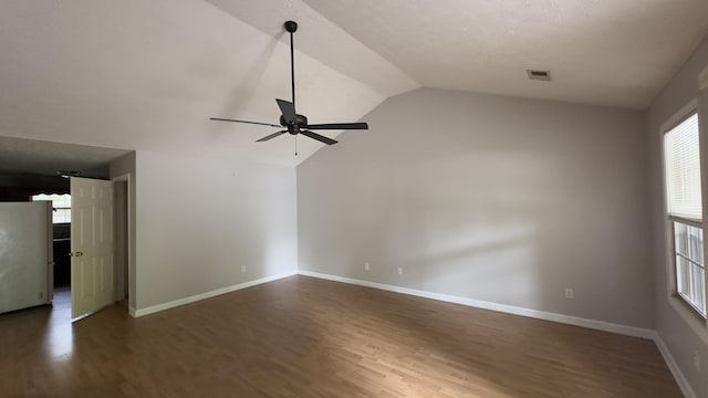 unfurnished living room with wood finished floors, baseboards, a ceiling fan, and vaulted ceiling