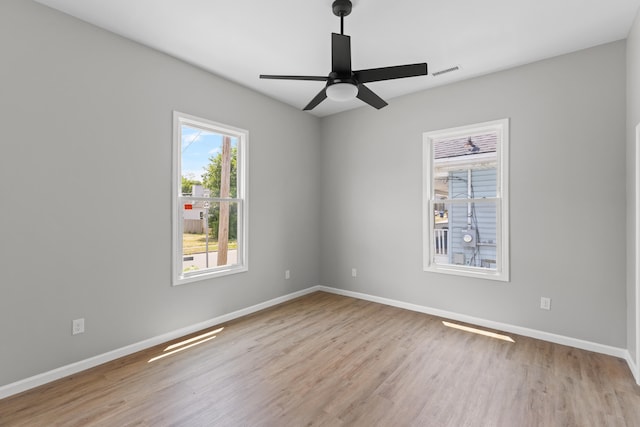 empty room with light wood-type flooring and ceiling fan