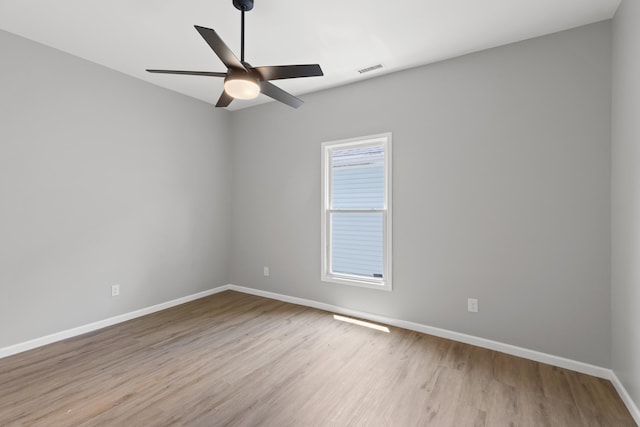 empty room featuring light hardwood / wood-style floors and ceiling fan