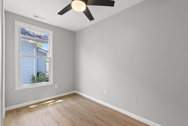 empty room with light wood-type flooring and ceiling fan