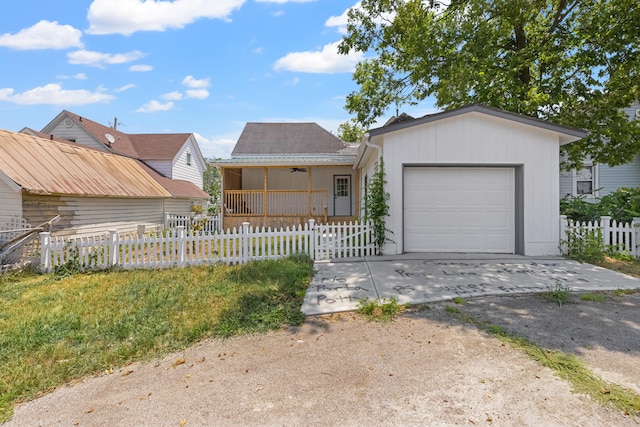 single story home featuring a front yard and a garage