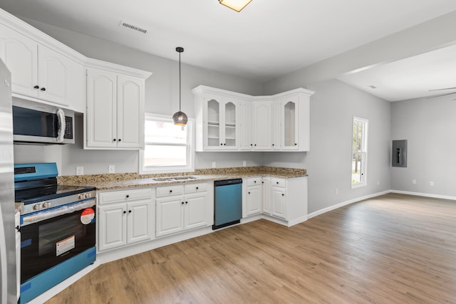 kitchen with white cabinetry, appliances with stainless steel finishes, light wood-type flooring, and hanging light fixtures