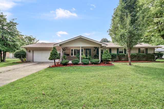 ranch-style home with a garage and a front lawn