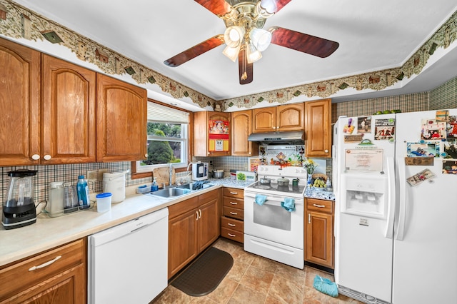 kitchen featuring tasteful backsplash, white appliances, sink, light tile patterned floors, and ceiling fan