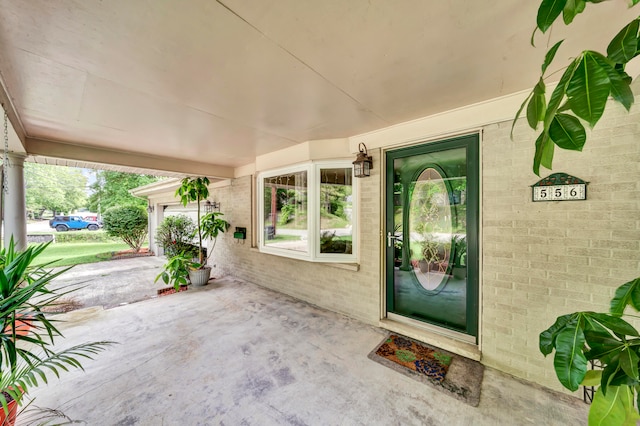 property entrance featuring a patio