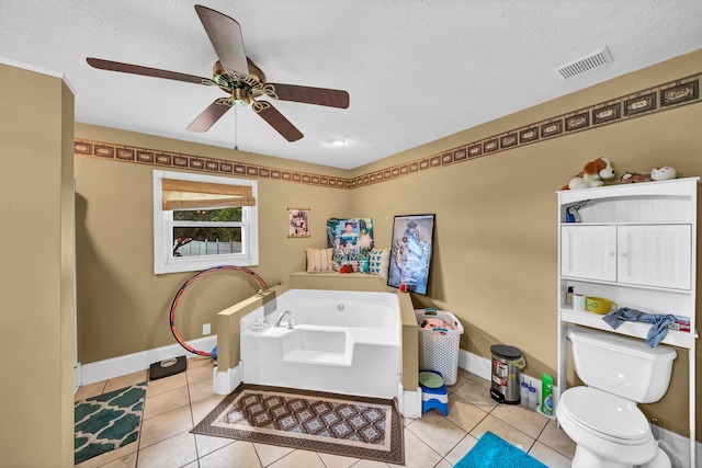 bathroom featuring toilet, a textured ceiling, ceiling fan, and tile patterned flooring