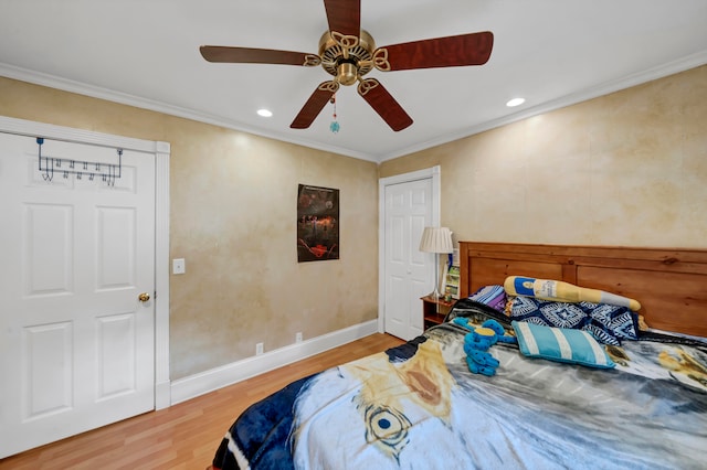 bedroom featuring ceiling fan, light wood-type flooring, and crown molding