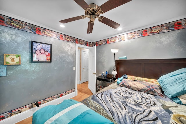 bedroom with ceiling fan and light hardwood / wood-style floors