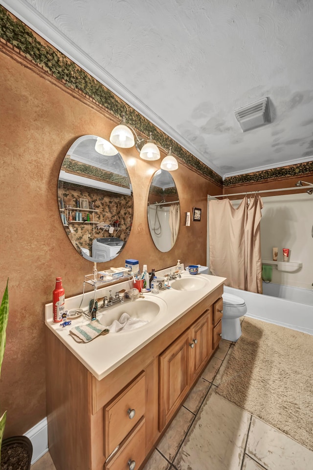 bathroom featuring double vanity, tile patterned floors, and toilet