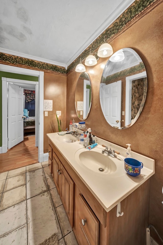 bathroom with tile patterned flooring, dual bowl vanity, and crown molding