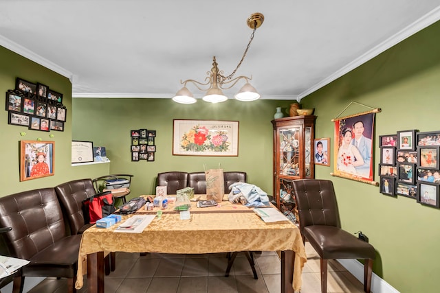 dining area with tile patterned floors and crown molding