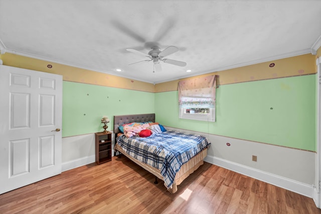 bedroom with ceiling fan, light hardwood / wood-style flooring, and ornamental molding