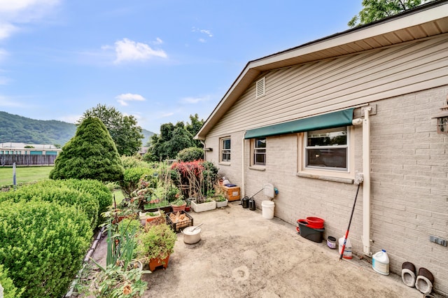 view of patio / terrace featuring a mountain view