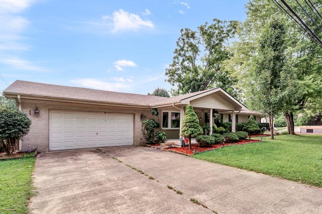 ranch-style home featuring a garage and a front yard