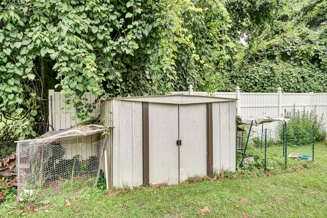 view of outdoor structure featuring a lawn