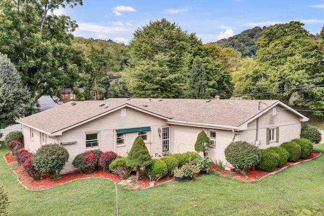 ranch-style house with a front yard