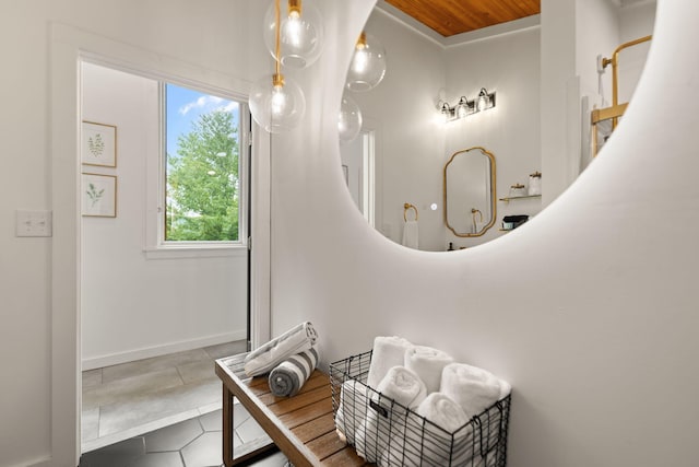 bathroom with tile patterned floors and wooden ceiling